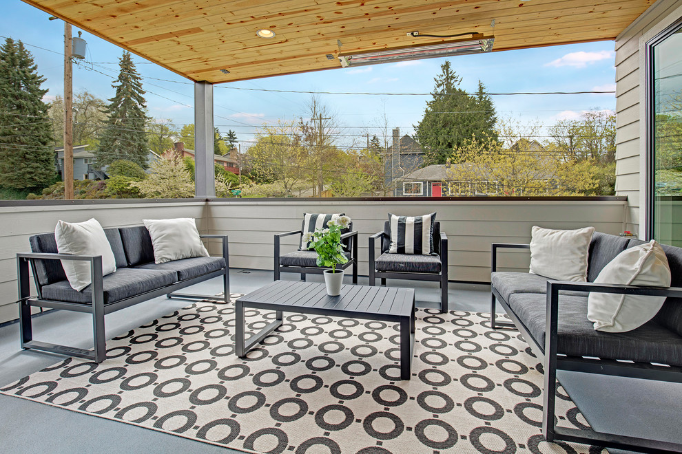 Inspiration for a country deck in Seattle with a roof extension.