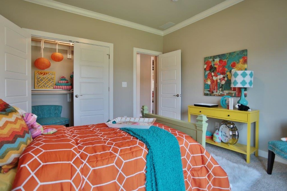 Design ideas for a mid-sized transitional kids' room for girls in Louisville with beige walls and carpet.