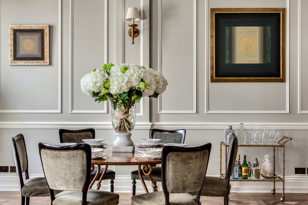 Design ideas for a traditional dining room in London with beige walls.