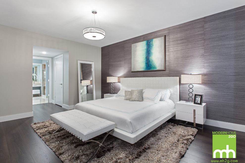 This is an example of a large modern master bedroom in Miami with multi-coloured walls.