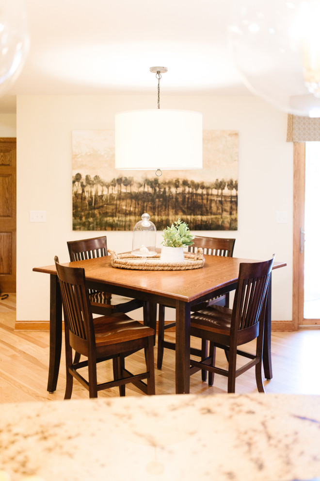Large transitional separate dining room in Minneapolis with medium hardwood floors.