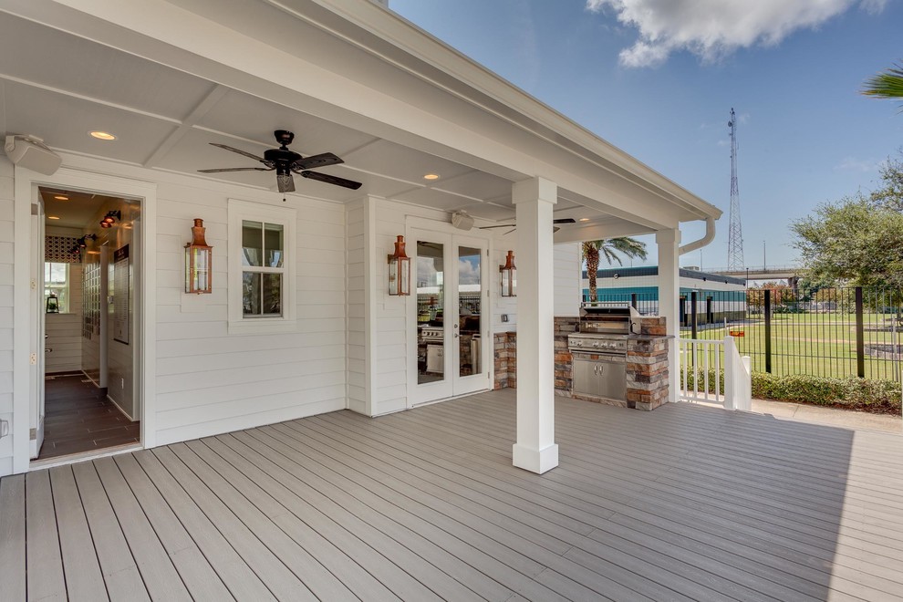 Inspiration for a mid-sized rustic backyard deck remodel in Jacksonville with a roof extension