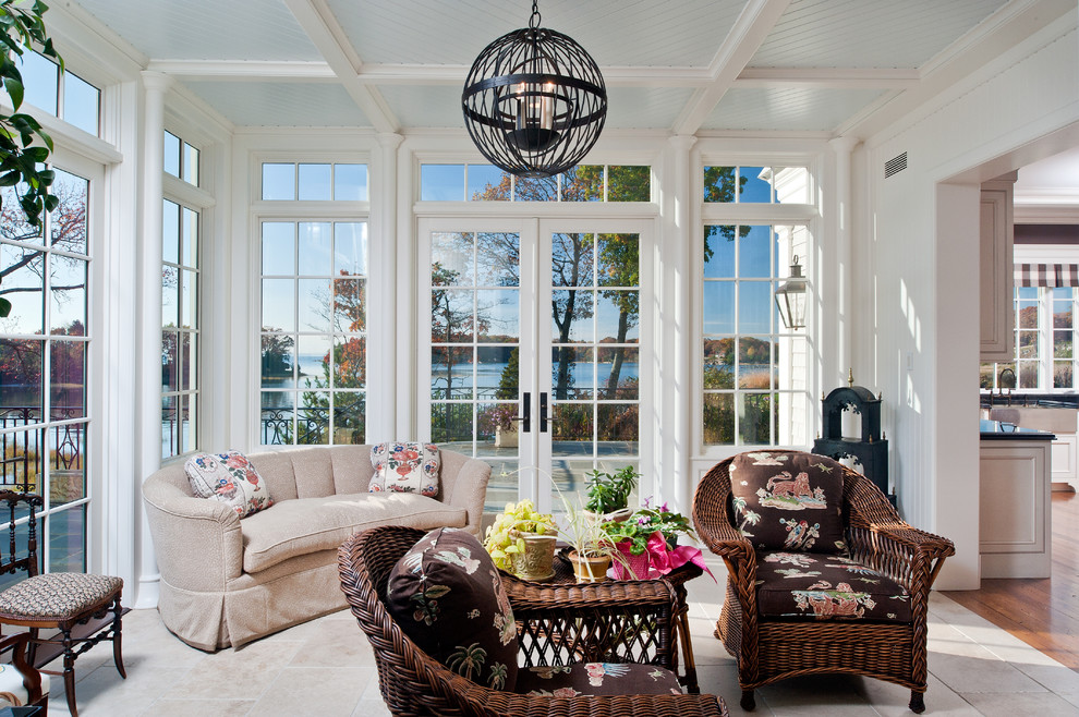 This is an example of a large traditional sunroom in New York with limestone floors and a standard ceiling.