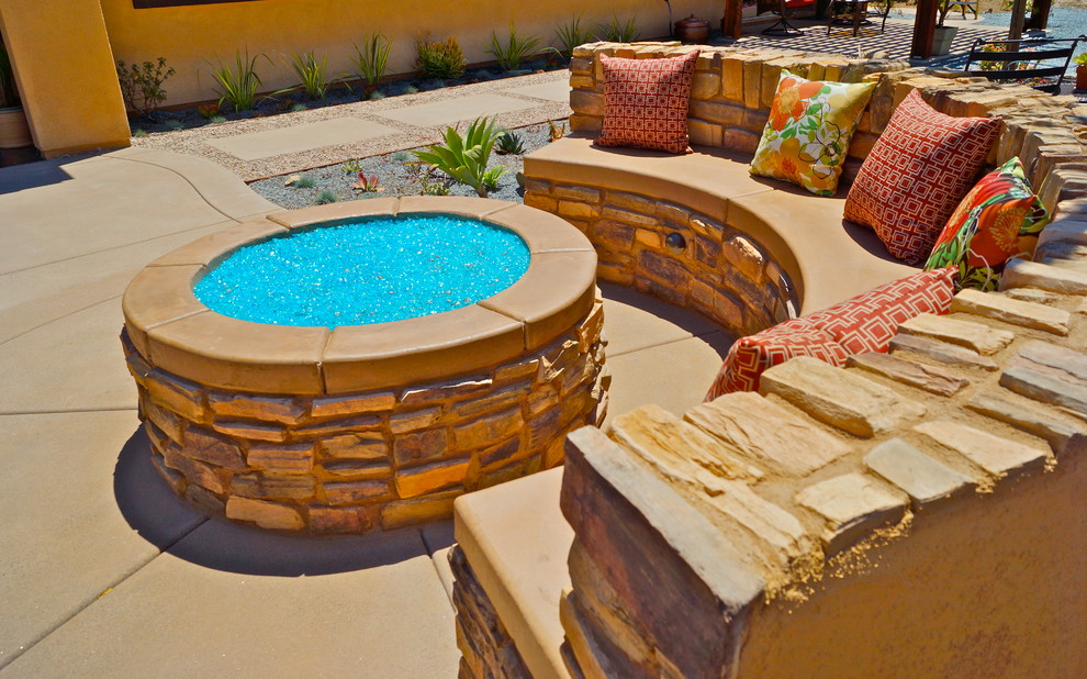 Design ideas for a large mediterranean backyard patio in San Diego with a fire feature, concrete pavers and no cover.