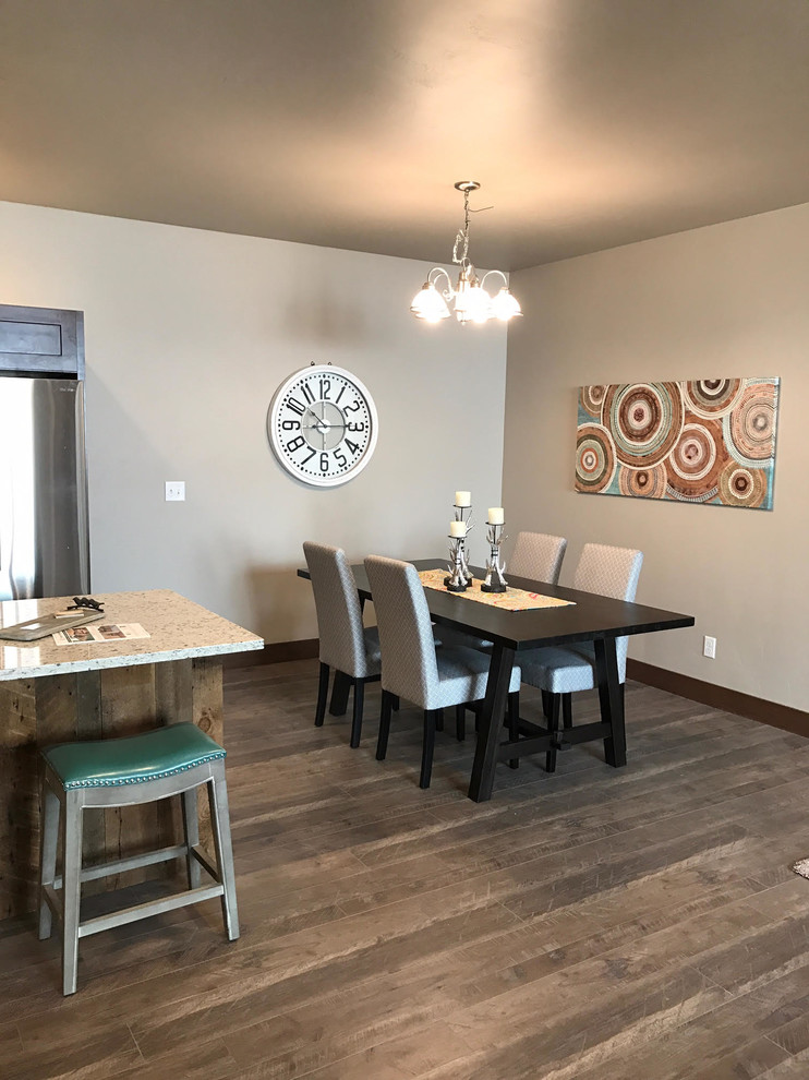 Mid-sized transitional medium tone wood floor and brown floor kitchen/dining room combo photo with beige walls
