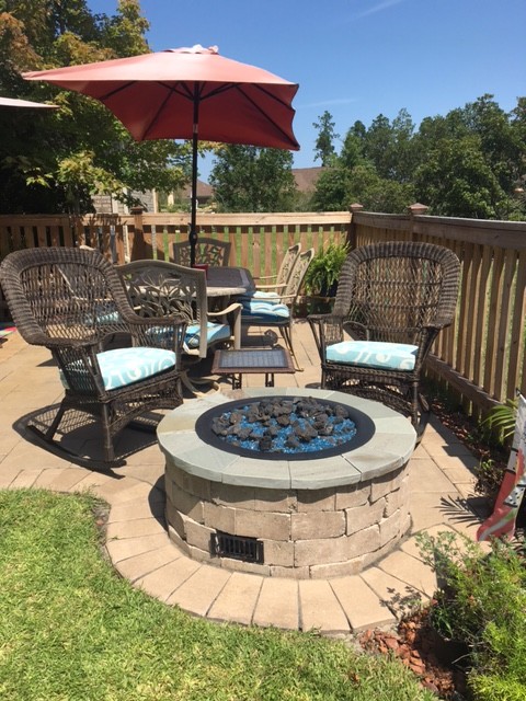 Inspiration for a small traditional backyard patio in Other with a fire feature, brick pavers and no cover.