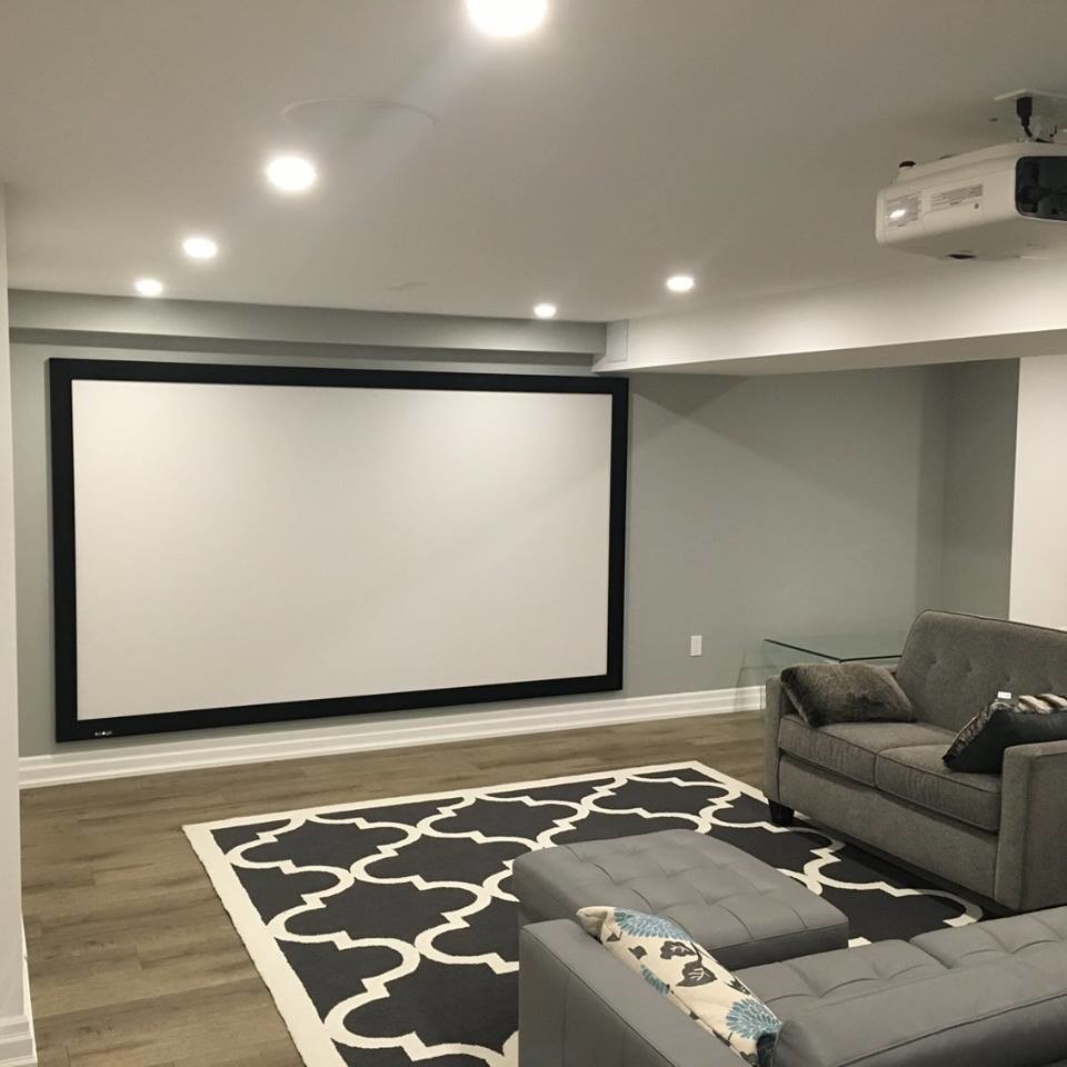 Mid-sized modern home theatre in Toronto.