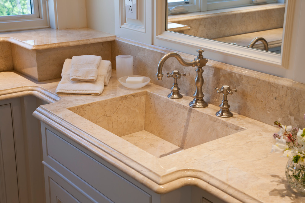 Design ideas for a mid-sized traditional 3/4 bathroom in Portland Maine with an integrated sink and marble benchtops.