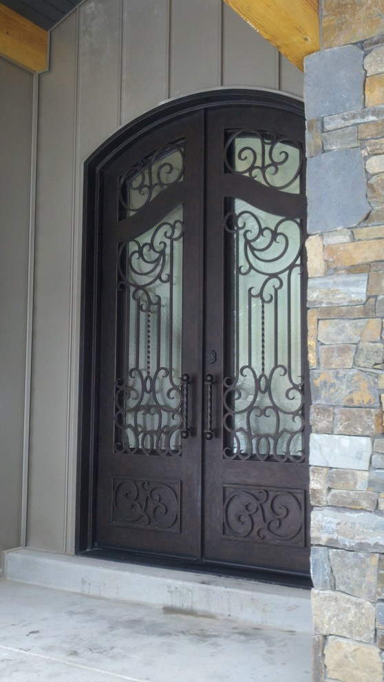 Inspiration for a small traditional front door in Other with a metal front door and a double front door.
