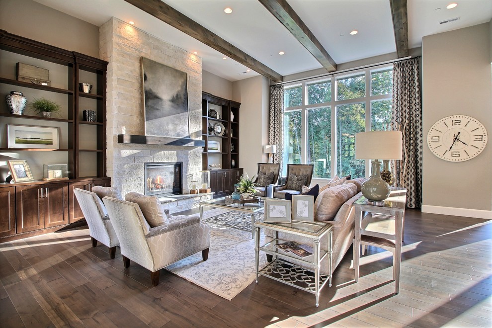 This is an example of an expansive transitional open concept family room in Portland with a home bar, grey walls, dark hardwood floors, a standard fireplace, a stone fireplace surround and no tv.