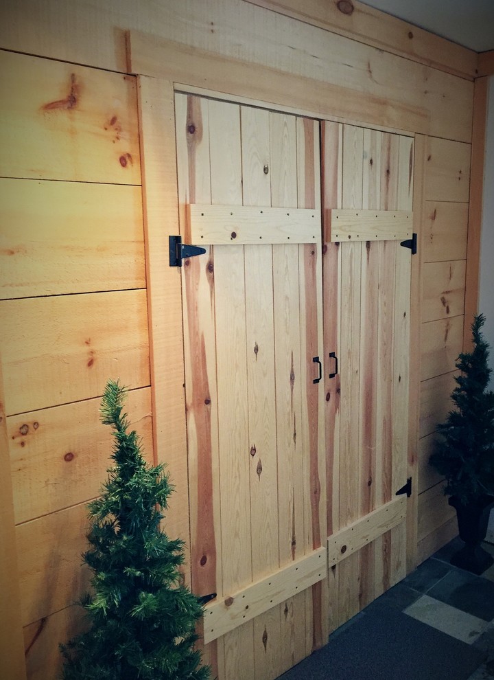 Inspiration for a mid-sized rustic slate floor foyer remodel in Toronto with a red front door