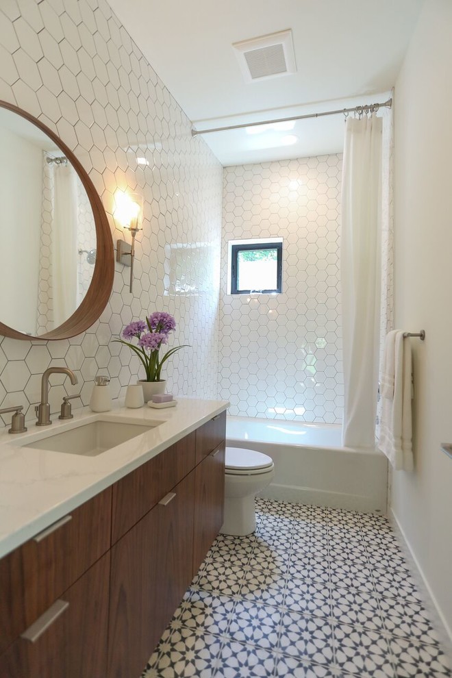 Mid-sized cottage white tile and porcelain tile cement tile floor and multicolored floor alcove bathtub photo in Minneapolis with flat-panel cabinets, dark wood cabinets, a two-piece toilet, white walls, an undermount sink and quartzite countertops