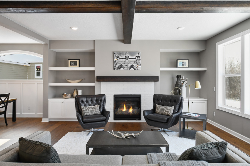 Large transitional formal open concept living room in Minneapolis with grey walls, medium hardwood floors, a standard fireplace, a tile fireplace surround, no tv and brown floor.