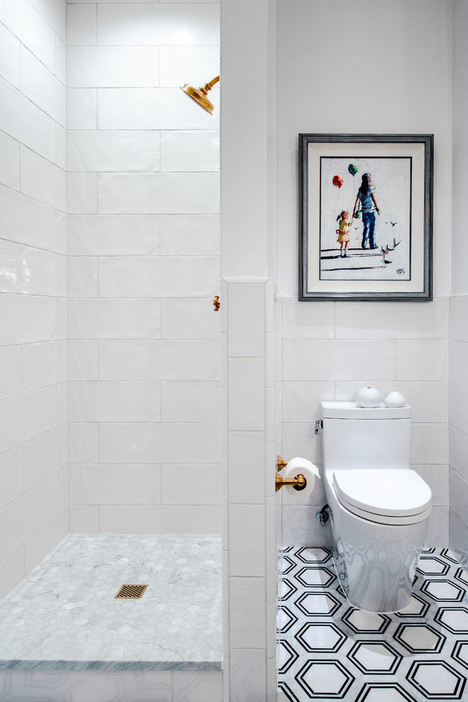 Design ideas for a mid-sized transitional 3/4 bathroom in Denver with flat-panel cabinets, dark wood cabinets, a one-piece toilet, ceramic tile, white walls, an integrated sink, marble benchtops, beige benchtops, an alcove shower, white tile, marble floors, multi-coloured floor and an open shower.