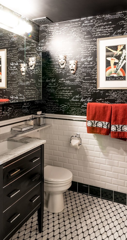 This is an example of a large traditional 3/4 bathroom in New York with flat-panel cabinets, black cabinets, an alcove shower, a one-piece toilet, black tile, black and white tile, white tile, subway tile, multi-coloured walls, porcelain floors, a drop-in sink, marble benchtops and yellow floor.
