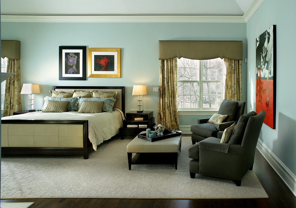 Inspiration for a large traditional master bedroom in New York with blue walls and dark hardwood floors.