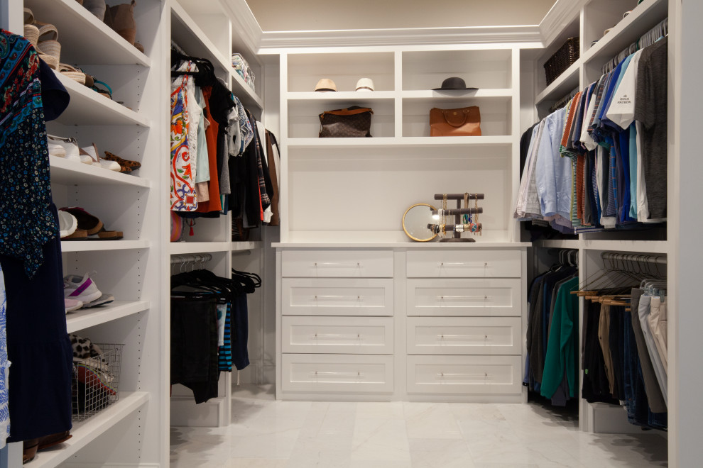 Photo of a large classic gender neutral walk-in wardrobe in Dallas with shaker cabinets, white cabinets, marble flooring and white floors.