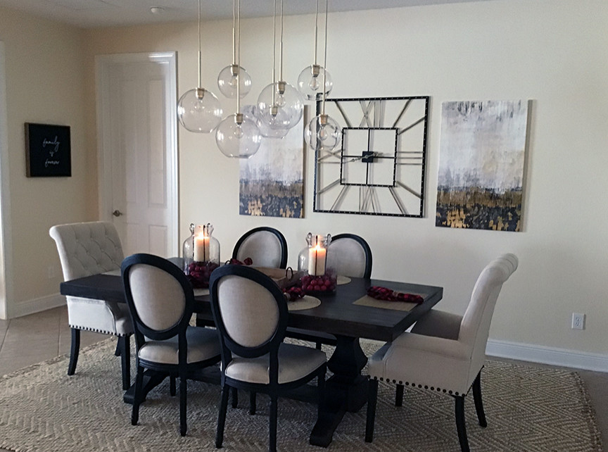 Photo of a large transitional open plan dining in Orlando with yellow walls, porcelain floors, no fireplace and beige floor.
