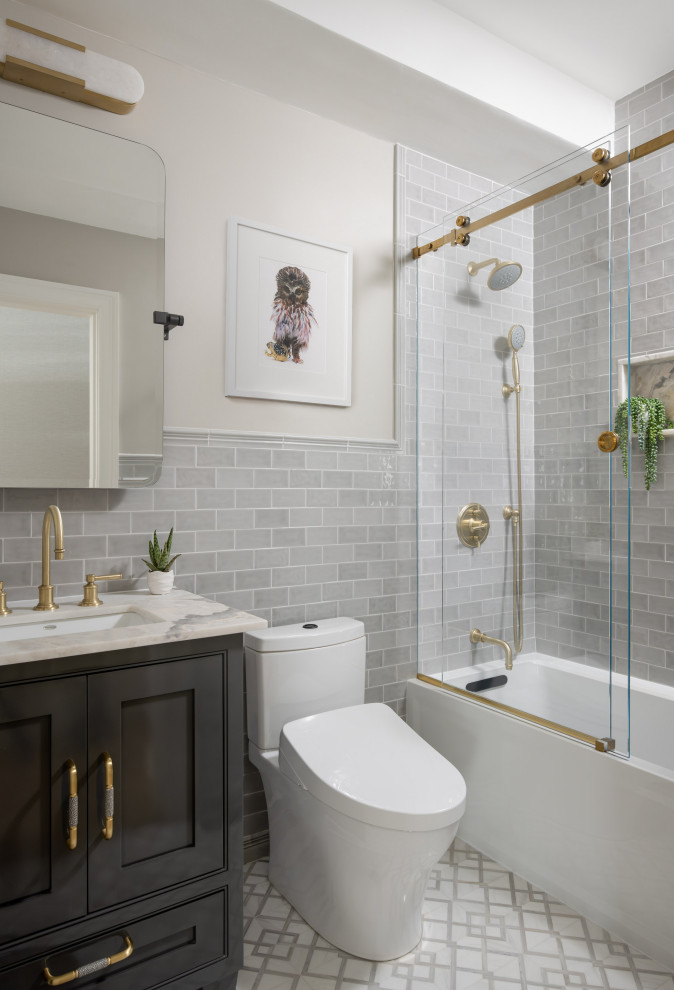 Photo of a medium sized classic family bathroom in Boston with beaded cabinets, grey cabinets, a built-in bath, a shower/bath combination, a bidet, grey tiles, ceramic tiles, beige walls, marble flooring, a built-in sink, quartz worktops, white floors, a sliding door, grey worktops, a wall niche, a single sink, a freestanding vanity unit and a coffered ceiling.