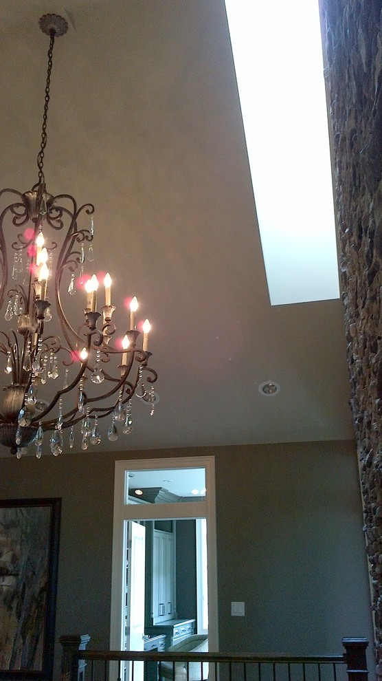 Home design - large transitional open concept medium tone wood floor home design idea in Toronto with beige walls