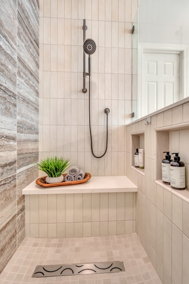 Photo of a large transitional master bathroom in Phoenix with recessed-panel cabinets, brown cabinets, a freestanding tub, an open shower, white tile, ceramic tile, grey walls, porcelain floors, an undermount sink, quartzite benchtops, beige floor, a hinged shower door, white benchtops, a double vanity and a built-in vanity.