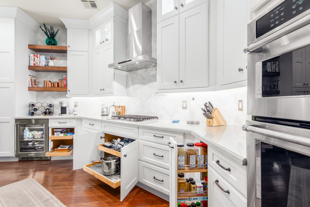Transitional kitchen photo in Phoenix with a farmhouse sink, shaker cabinets, white cabinets, white backsplash, subway tile backsplash and white countertops