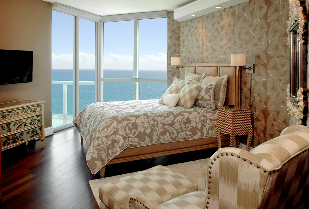 Photo of a large tropical guest bedroom in Miami with brown walls and no fireplace.