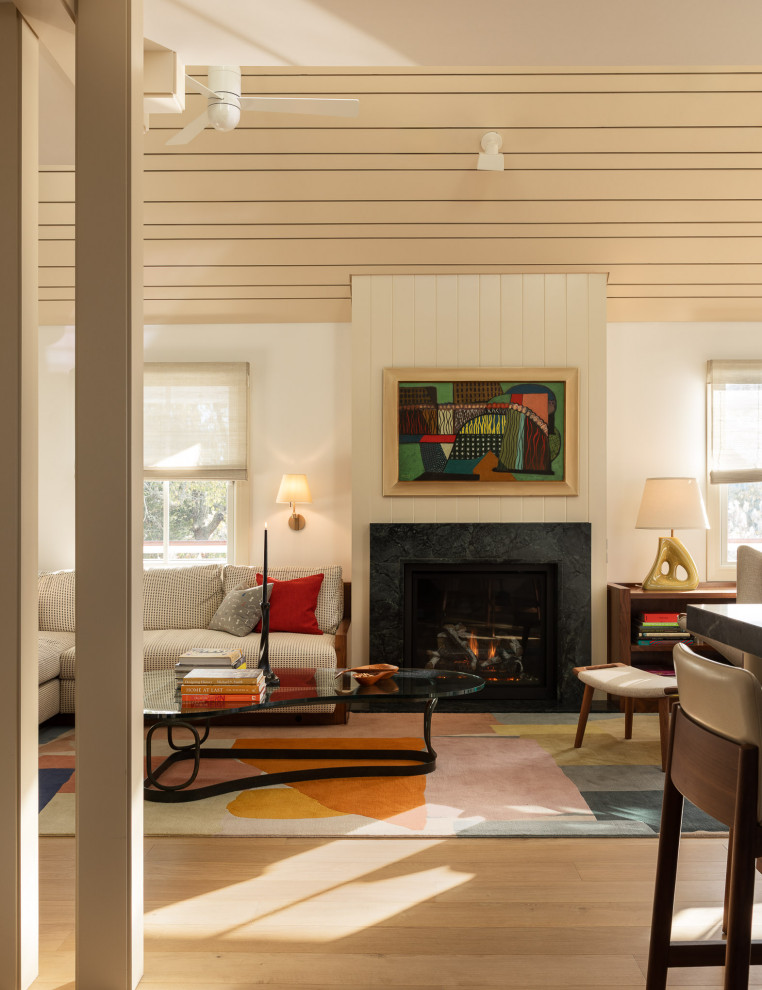 Inspiration for a coastal light wood floor, beige floor and wood ceiling living room remodel in Philadelphia with white walls and a standard fireplace
