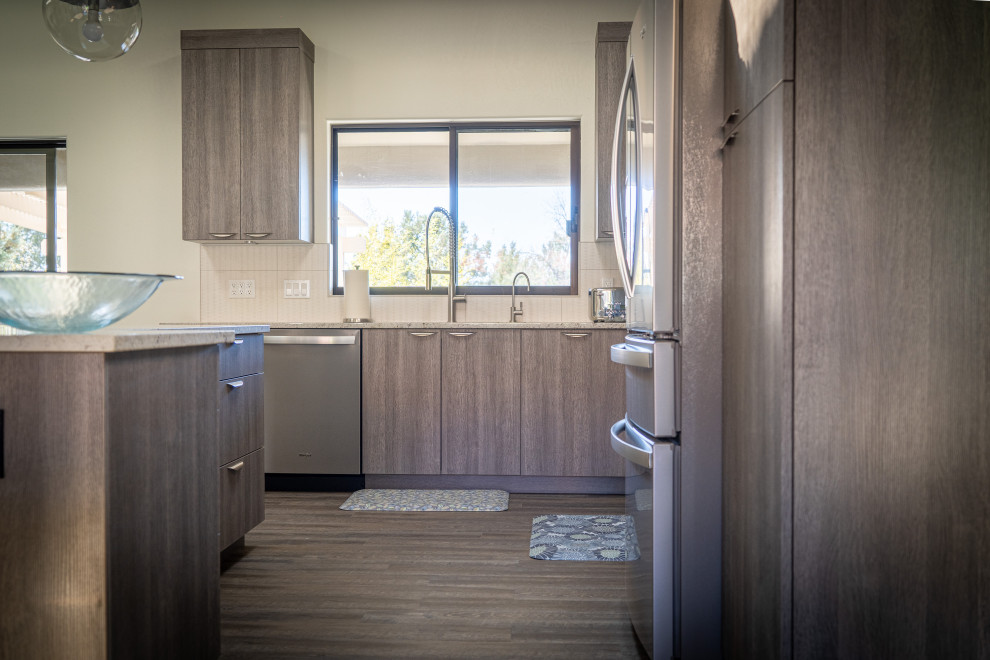 Kitchen - contemporary kitchen idea in Phoenix with flat-panel cabinets, gray cabinets, stainless steel appliances and an island