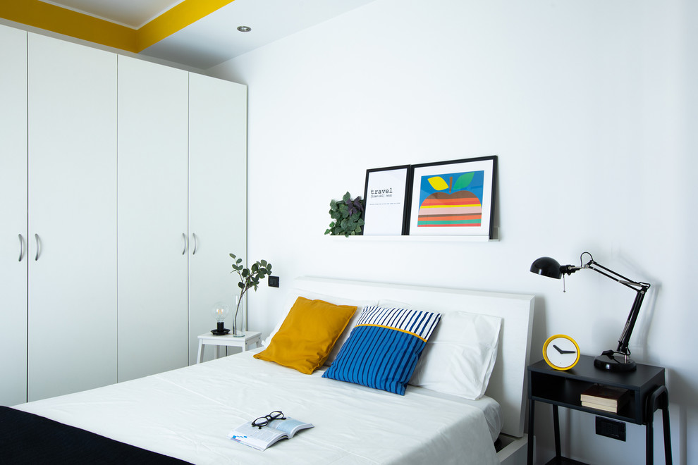 Design ideas for a contemporary bedroom in Turin with white walls.