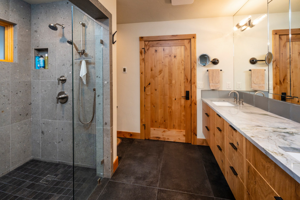 Mid-sized transitional master gray tile and cement tile ceramic tile, gray floor and double-sink bathroom photo in Other with flat-panel cabinets, white walls, an undermount sink, granite countertops, a hinged shower door and a floating vanity