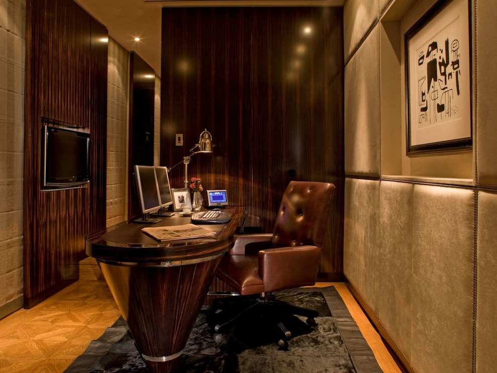 Contemporary home office in London with medium hardwood flooring and a freestanding desk.