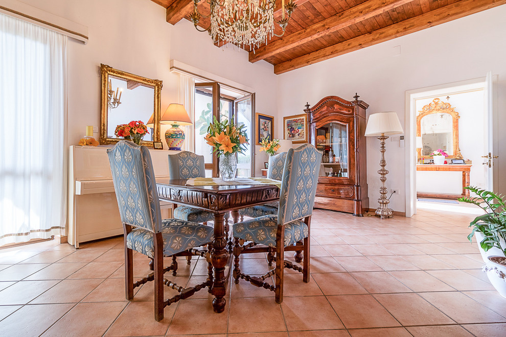 Inspiration for a mid-sized traditional dining room in Naples with white walls and ceramic floors.
