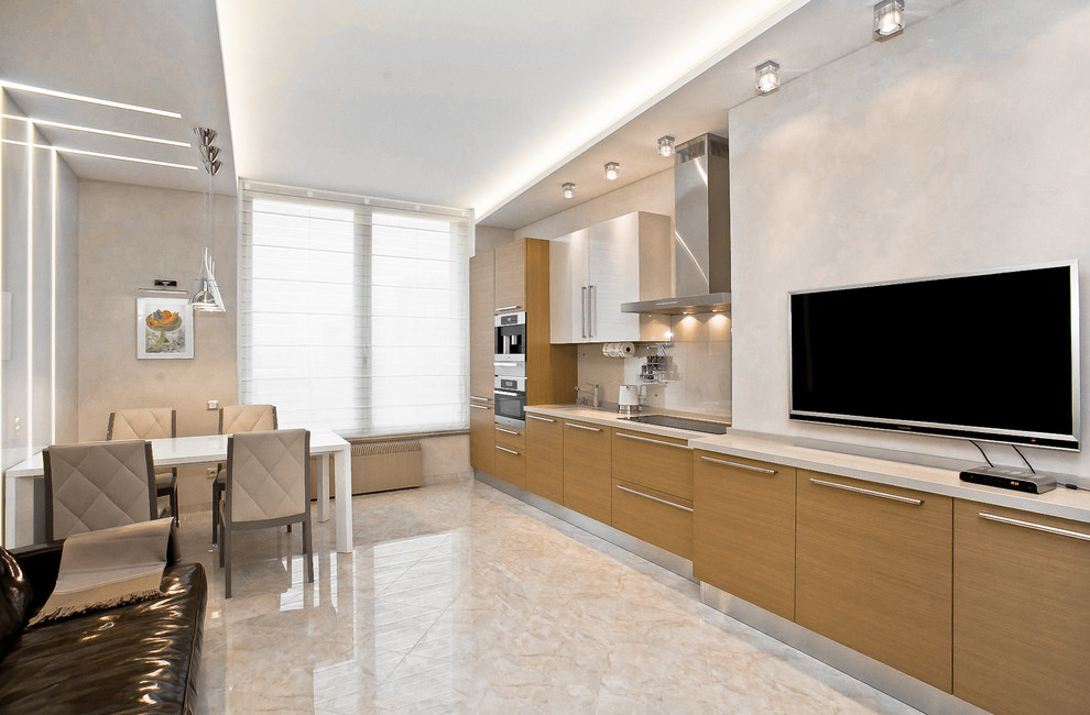 Mid-sized contemporary single-wall eat-in kitchen in Moscow with a single-bowl sink, flat-panel cabinets, medium wood cabinets, marble benchtops, white splashback, glass sheet splashback, stainless steel appliances, marble floors, no island and beige floor.