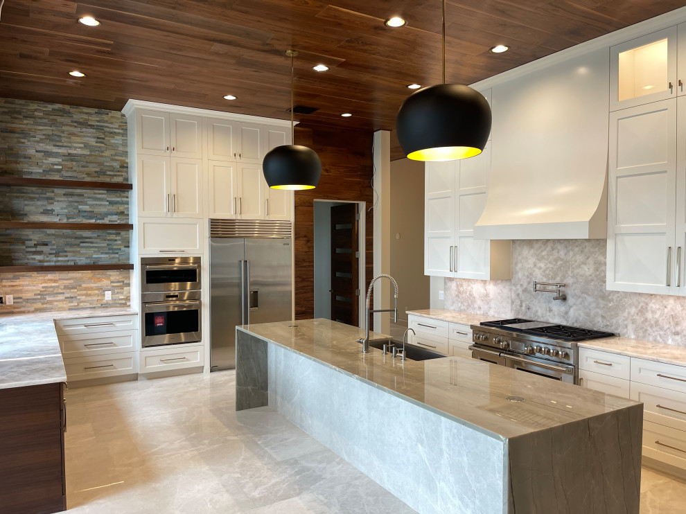 Open concept kitchen - large modern u-shaped marble floor, white floor and wood ceiling open concept kitchen idea in Orlando with a single-bowl sink, beaded inset cabinets, white cabinets, quartzite countertops, gray backsplash, stainless steel appliances, an island and white countertops