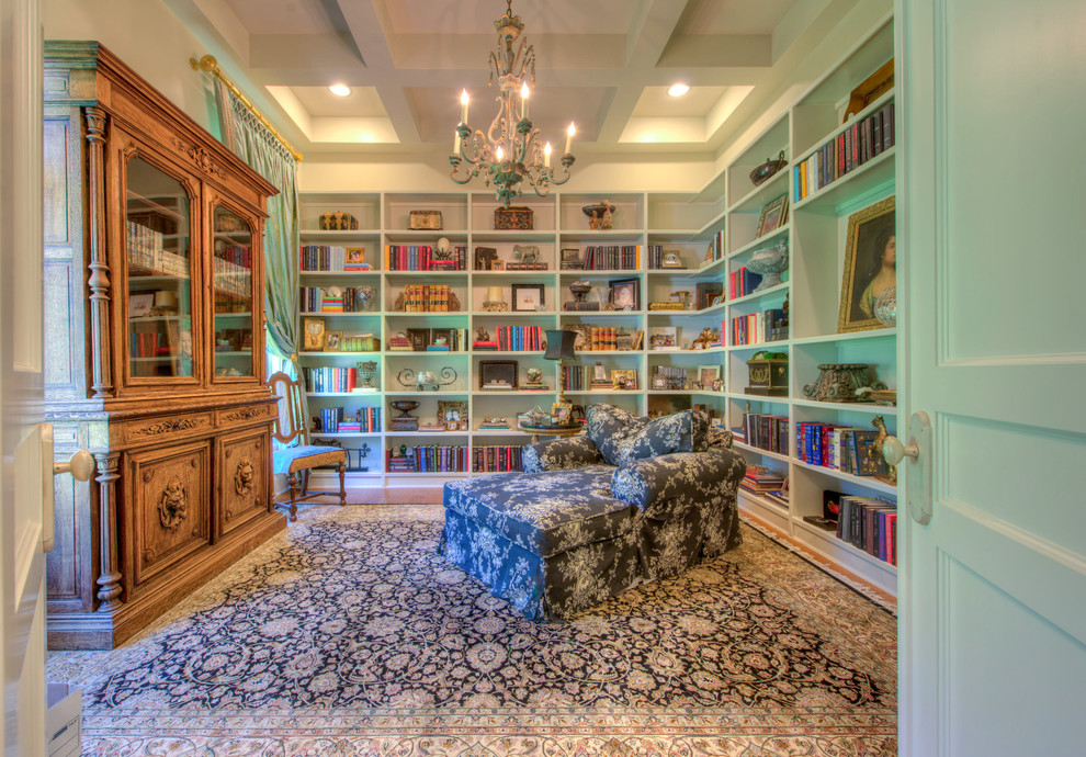 Small mediterranean enclosed family room in Austin with a library.