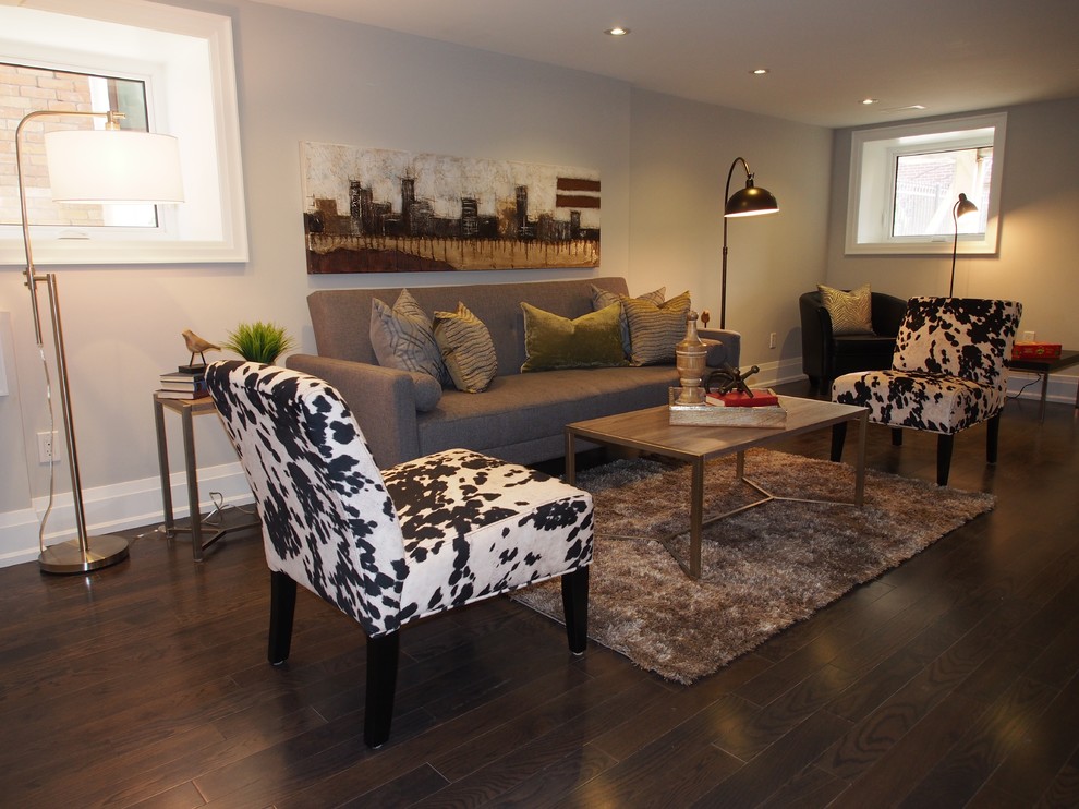 Photo of a large transitional family room in Toronto with grey walls and dark hardwood floors.