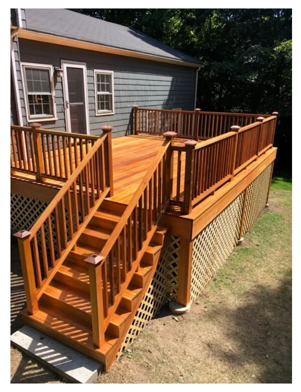 Inspiration for a backyard wood railing deck remodel in Boston