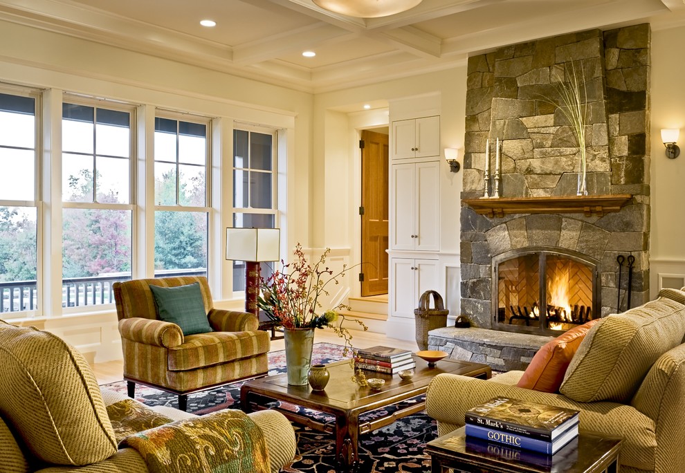 Traditional living room in Burlington with a stone fireplace surround.