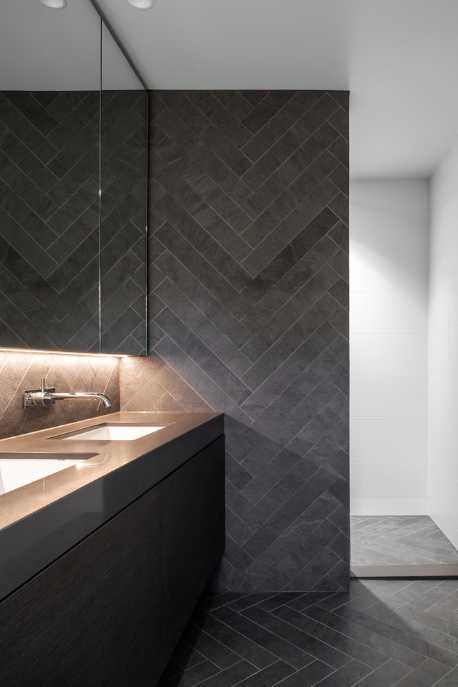 Contemporary master bathroom in Adelaide with a freestanding tub, a corner shower, a one-piece toilet, gray tile, white walls, grey floor and an open shower.