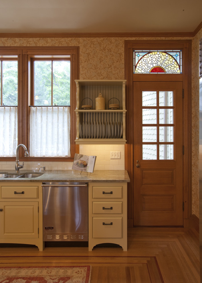 This is an example of a traditional kitchen in Boston with stainless steel appliances.