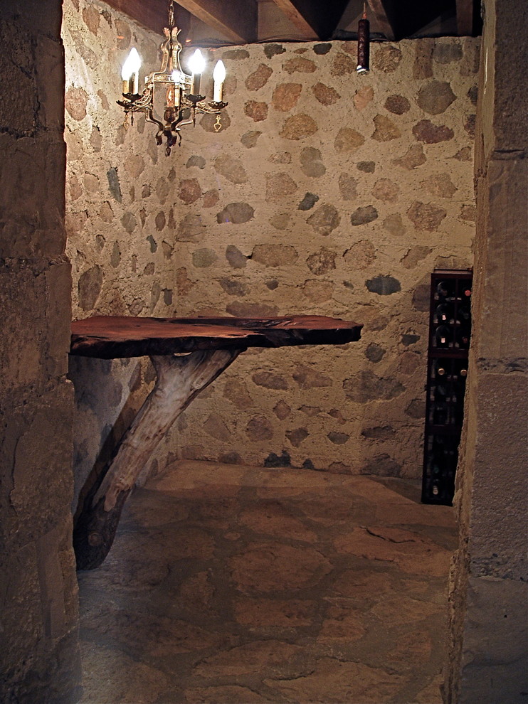 Example of a mountain style wine cellar design in Milwaukee