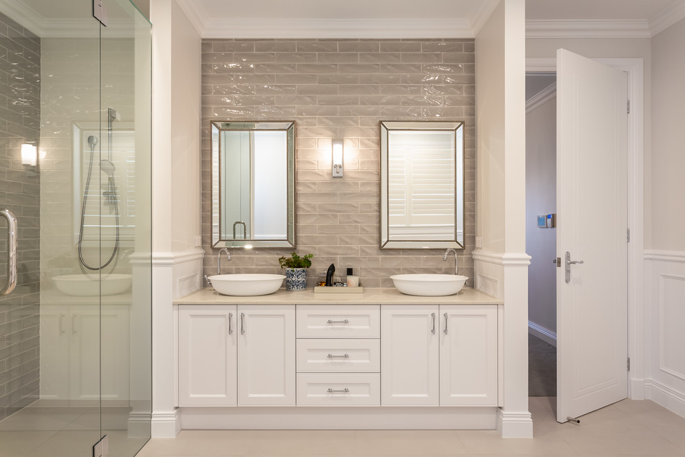 Design ideas for a small beach style 3/4 bathroom in Gold Coast - Tweed with shaker cabinets, white cabinets, gray tile, subway tile, grey walls, ceramic floors, a drop-in sink, engineered quartz benchtops, beige floor, a hinged shower door and beige benchtops.