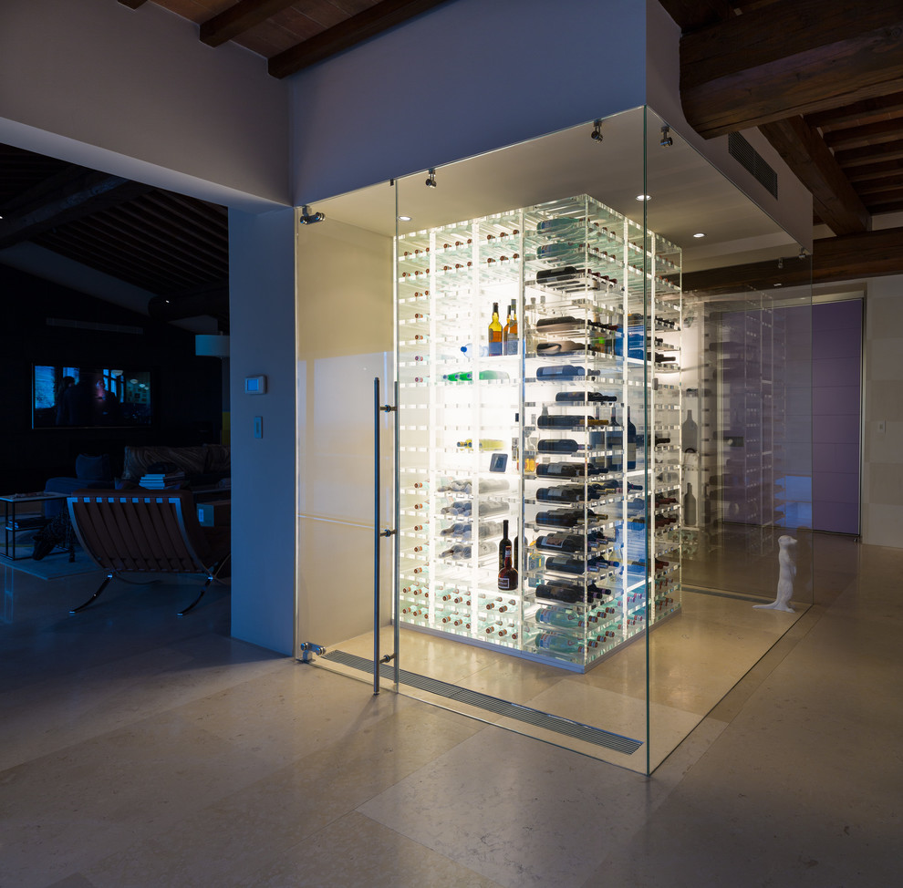 Mid-sized country wine cellar in Denver with travertine floors, storage racks and beige floor.