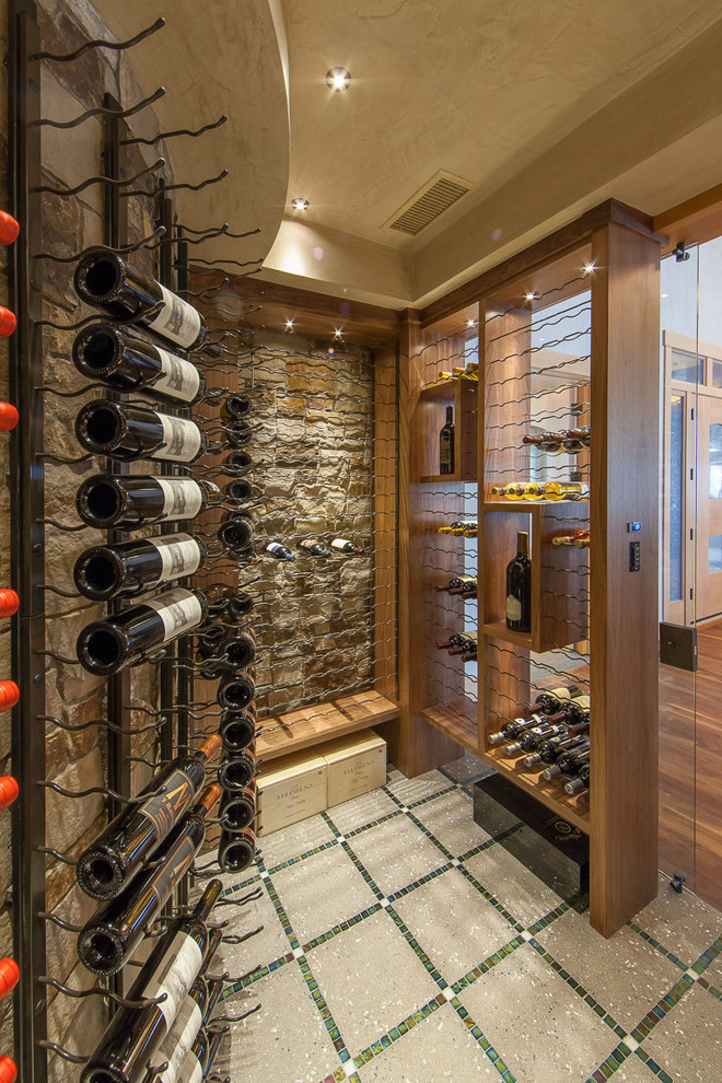 Inspiration for a large contemporary wine cellar in Denver with concrete floors, multi-coloured floor and display racks.