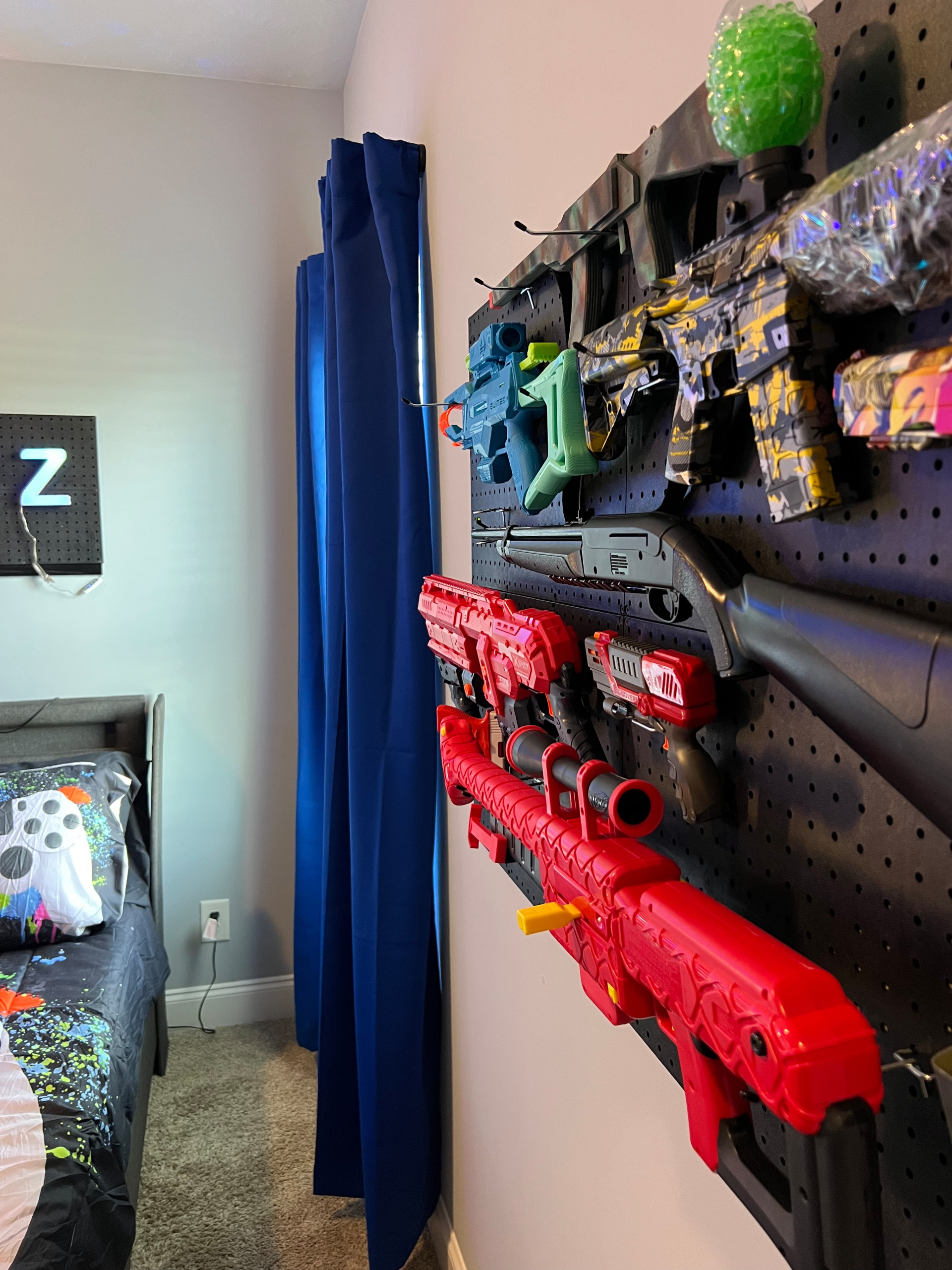 Blue Curtains and Nerf Gun Wall