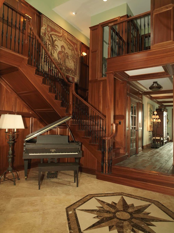 Large traditional wood l-shaped staircase in Baltimore with wood risers.
