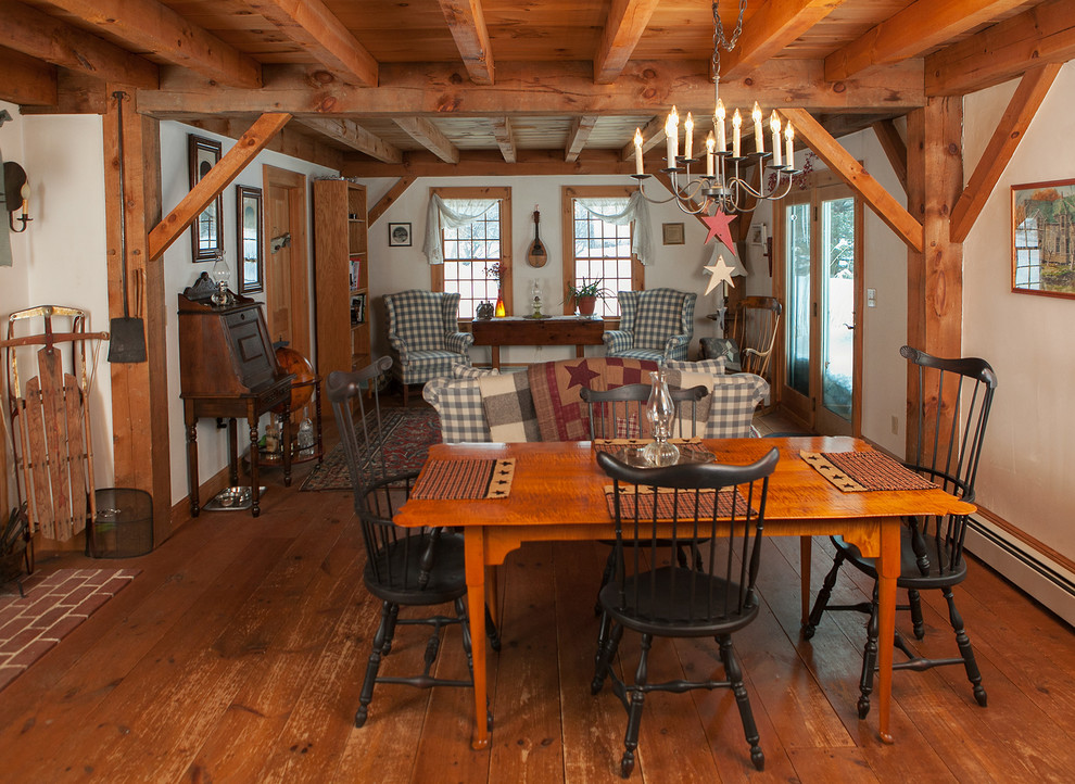 Large country open plan dining in Boston with white walls and medium hardwood floors.