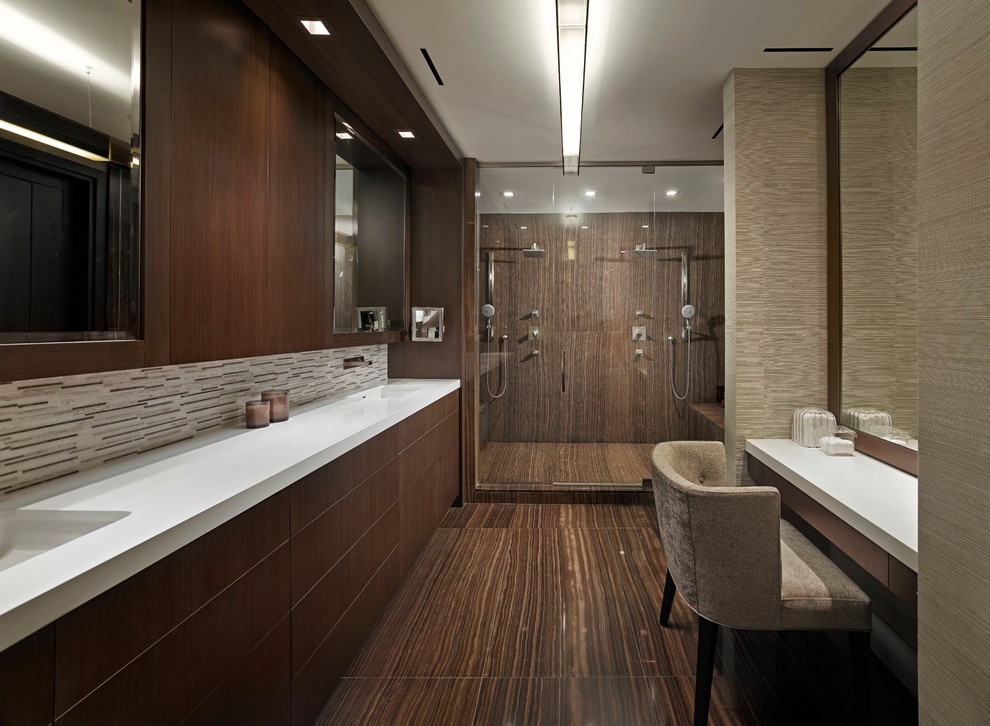 Design ideas for a contemporary bathroom in Miami with flat-panel cabinets, dark wood cabinets, an alcove shower, brown tile, marble floors and white benchtops.