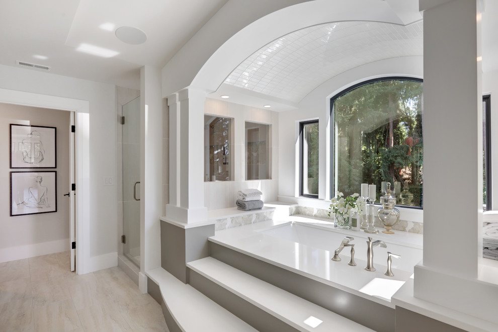 Inspiration for a mid-sized contemporary master bathroom in Seattle with recessed-panel cabinets, grey cabinets, an undermount tub, grey walls, porcelain floors, an undermount sink, quartzite benchtops, white floor and white benchtops.